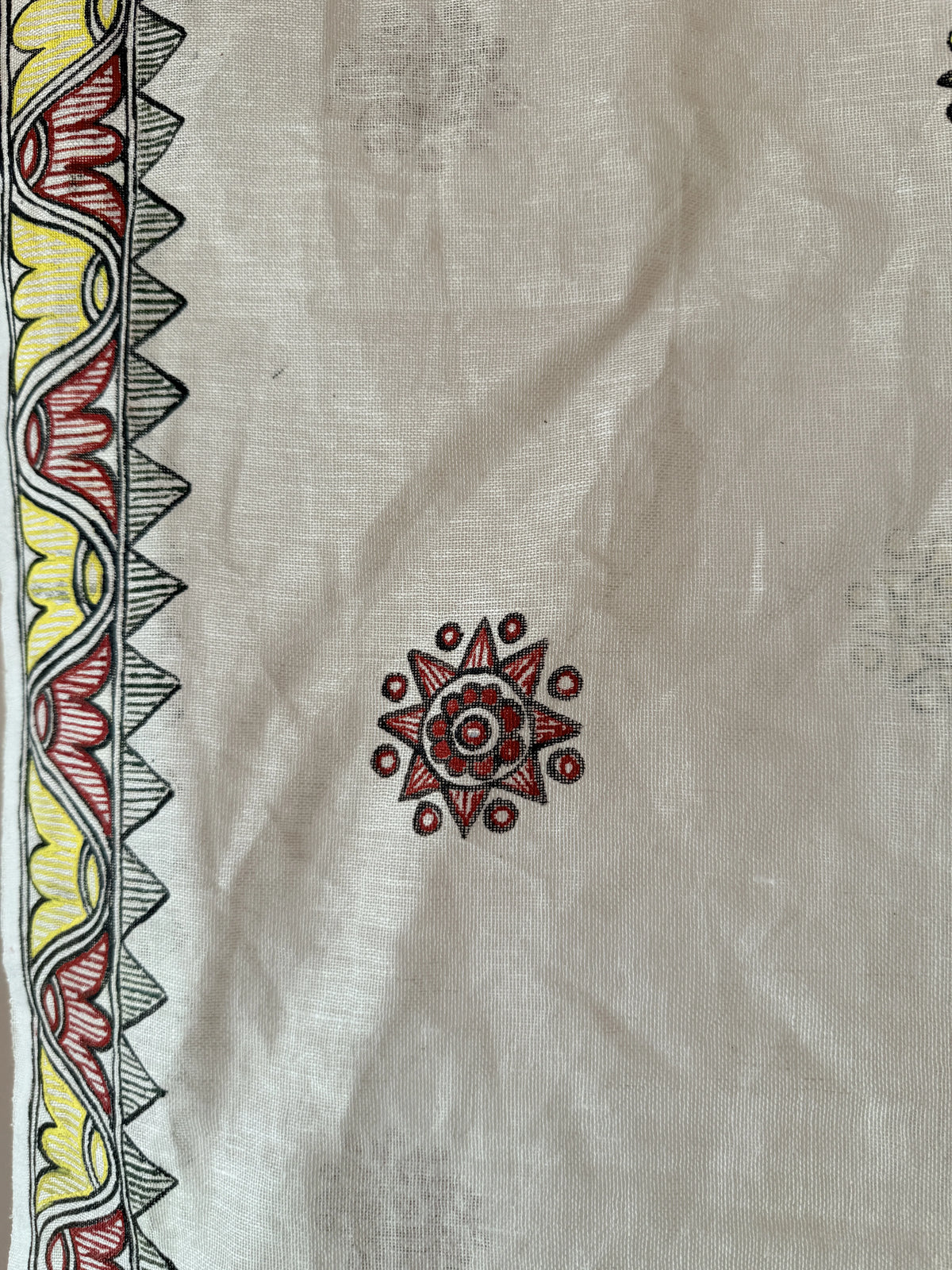 White Madhubani hand painted dupatta with sun motifs and lotus border – drape view