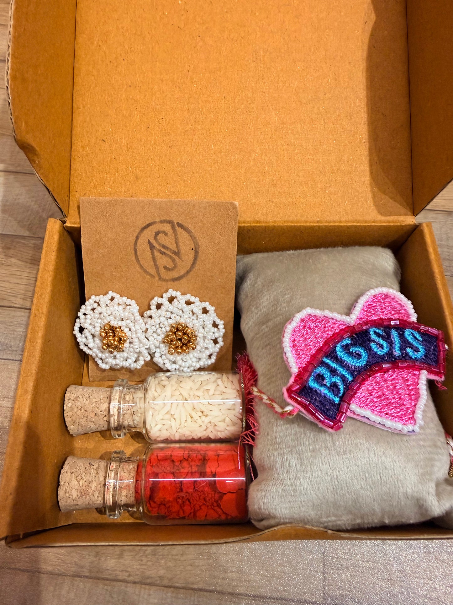Big Sis Rakhi gift box with earrings and kumkum bottle