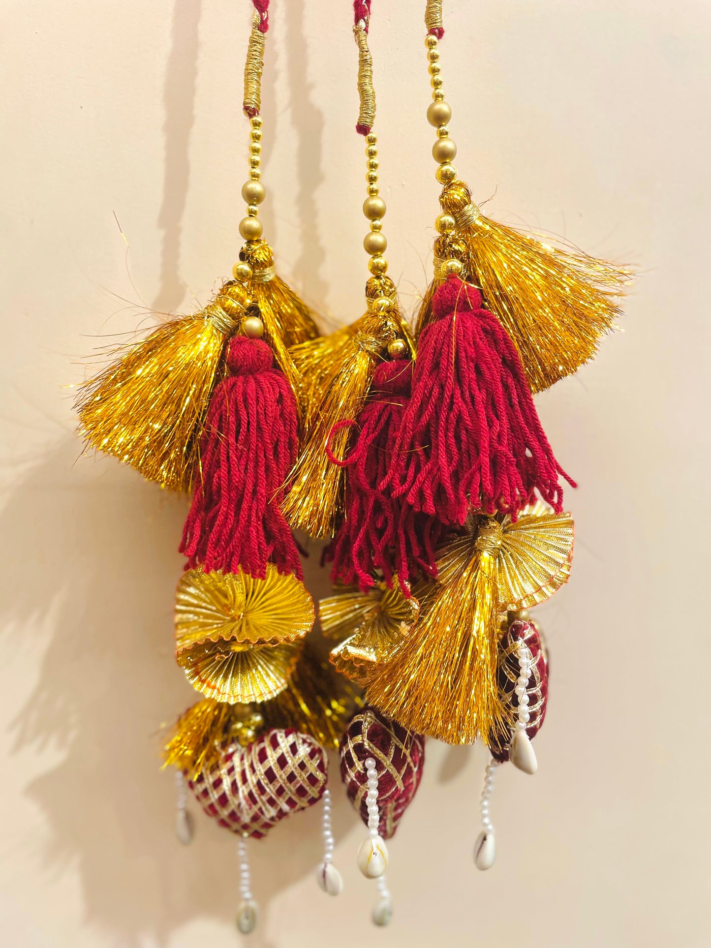 Royal Maroon & Gold Bridal Paranda with Cowrie Shell Detailing