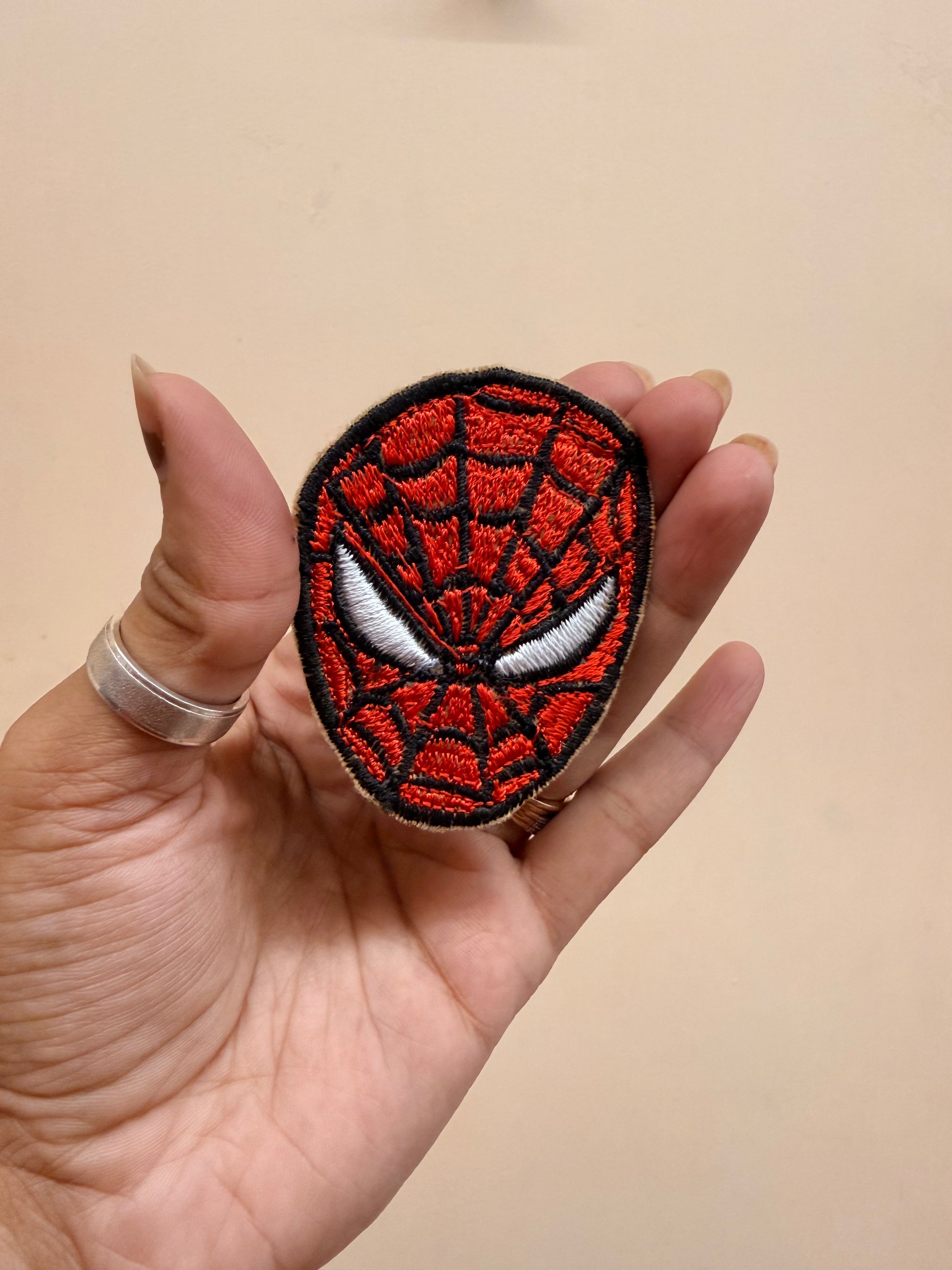 Spider-Man Face Embroidered Brooch front