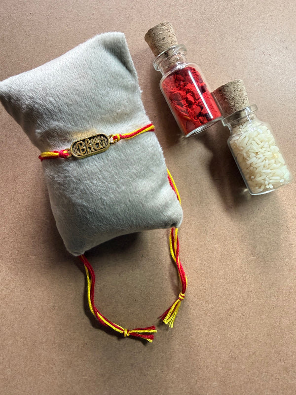 Om Charm Rakhi - Red & Yellow Thread image 1