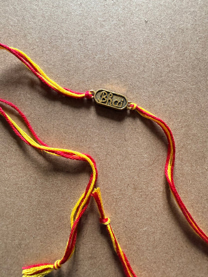 Om Charm Rakhi - Red & Yellow Thread image 2