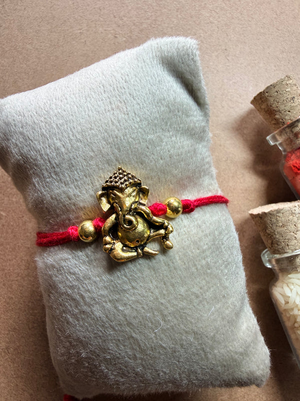 Ganesha Charm Rakhi image 1