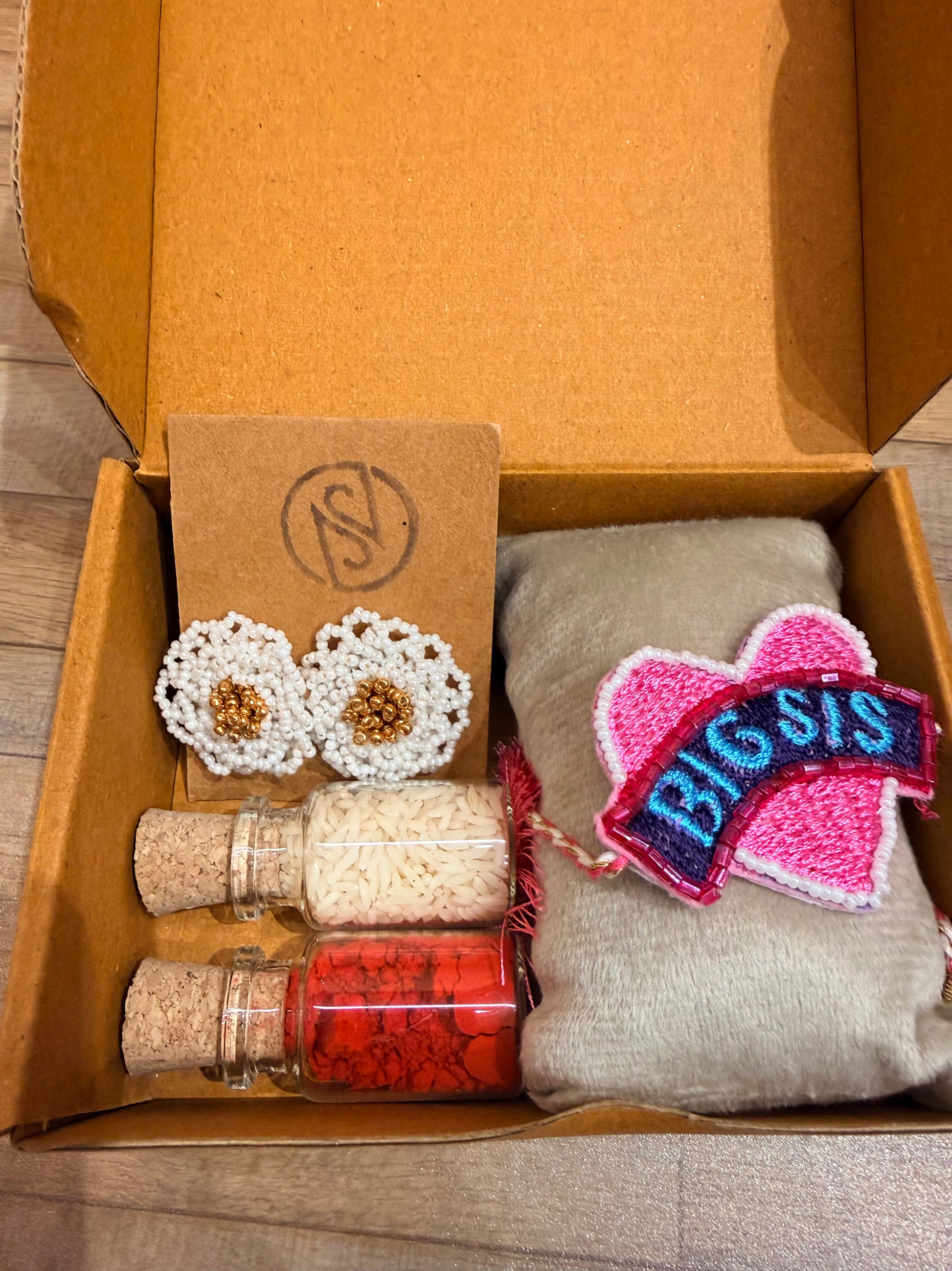 Big Sis Rakhi gift box with earrings and kumkum bottle
